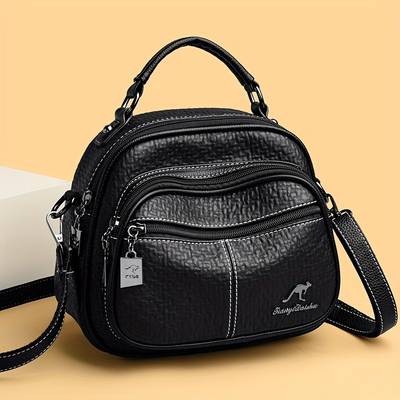 OGEHUAFEE Womens Elegant Mini Backpack  Premium PU Crossbody/Backpack Hybrid with Kangaroo Logo & Tassel Accents