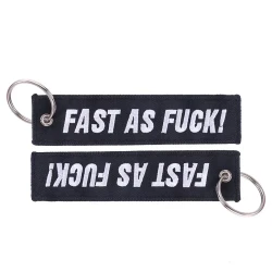 Bicycle Pendant White Embroidered Keychain On Black Background