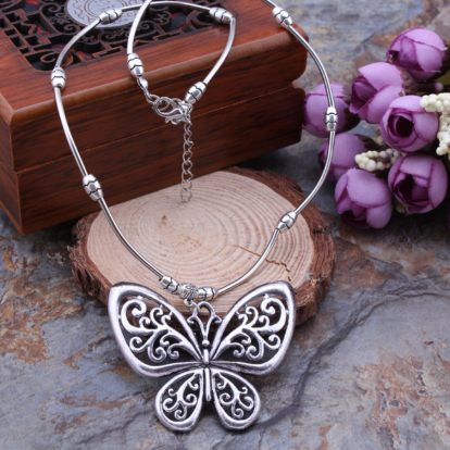 Carved openwork butterfly pendant