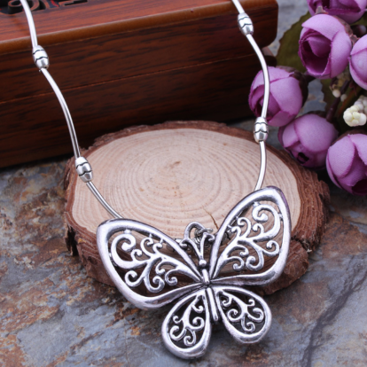 Carved openwork butterfly pendant