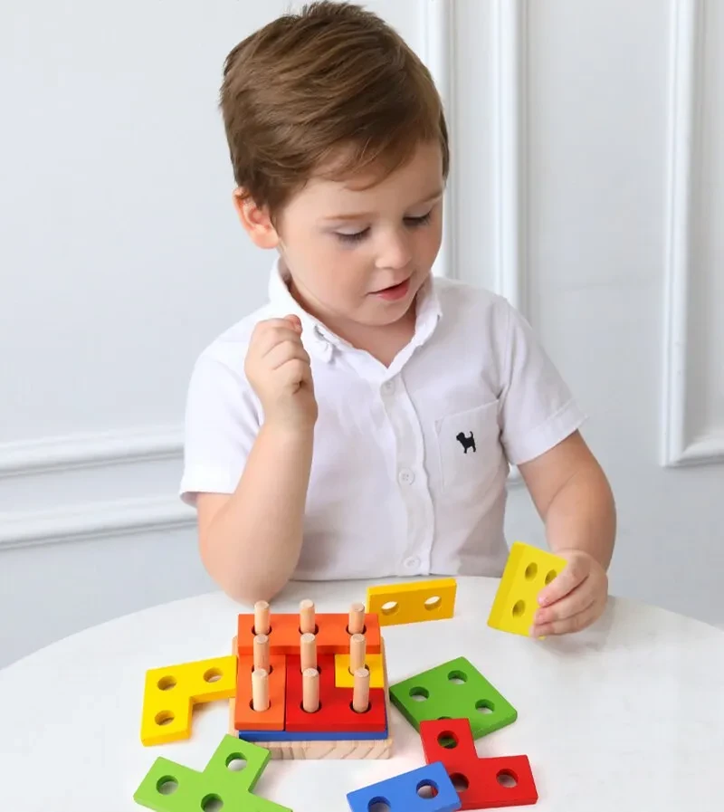 Young children assembling cube toy