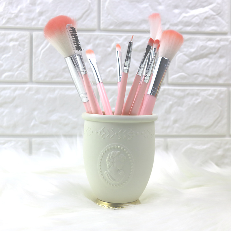 Embossed makeup brush tube