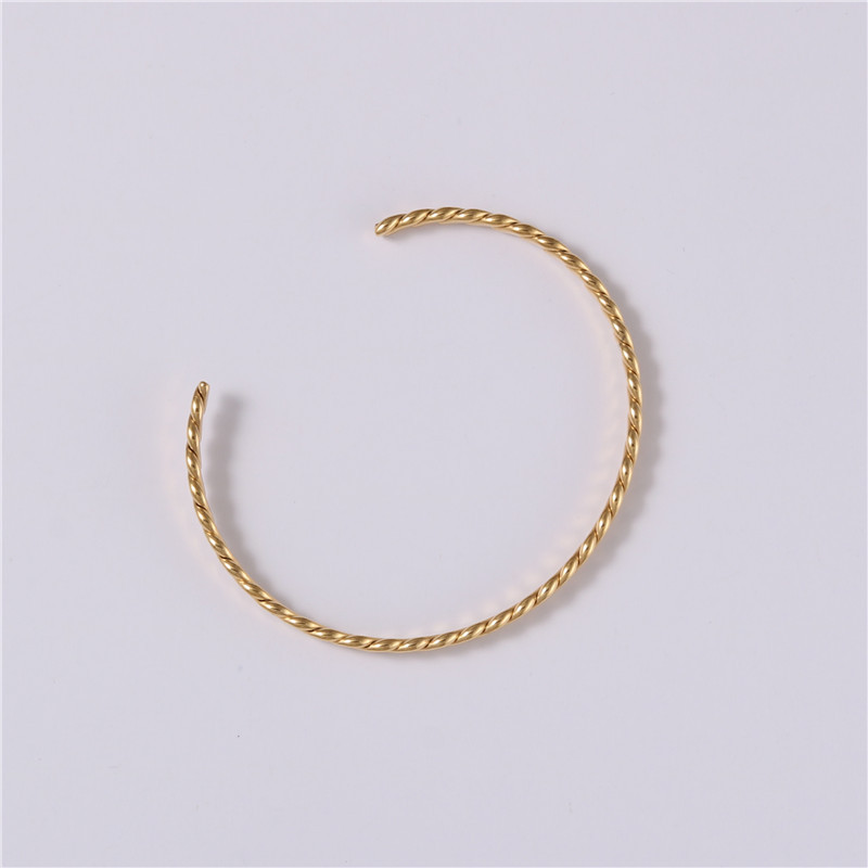 Embossed woven metal bracelet