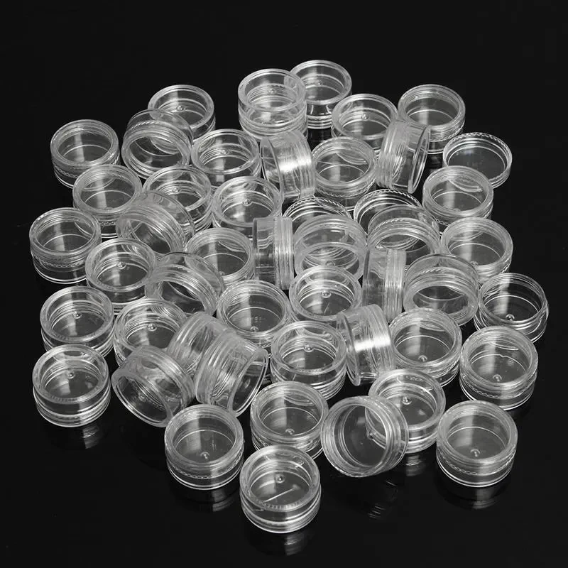 Small round clear plastic containers with lids